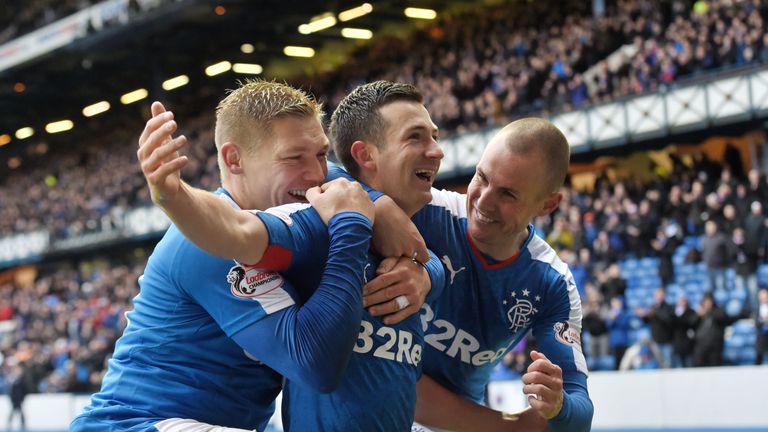 Jason Holt (centre) is congratulated by Martyn Waghorn and Kenny Miller (right) after opening the scoring for Rangers against St Mirren