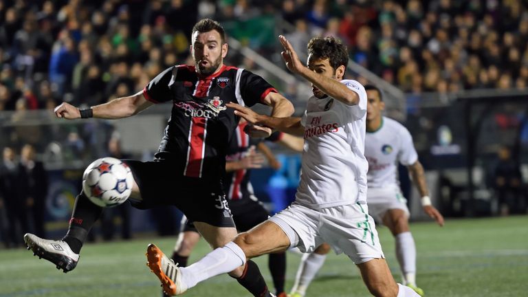 NY Cosmos player Raul (R) stretches for a goal attempt covered by Ottawa Fury defender Colin Falvey