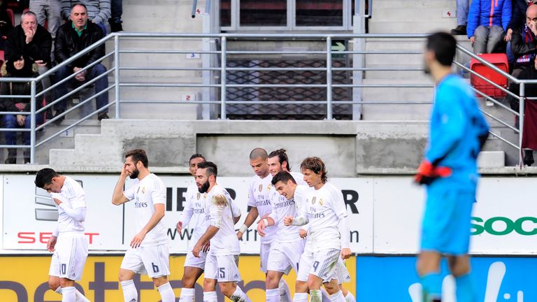 Real Madrid players walk after celebratin their first goal with teammates during the Spanish league football match SD Eibar vs Real Madrid CF at the Ipurua