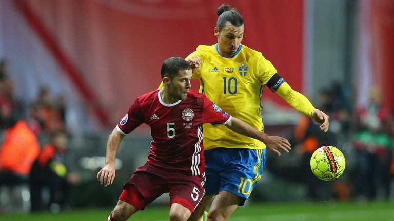  Riza Durmisi of Denmark and Zlatan Ibrahimovic of Sweden compete for the ball