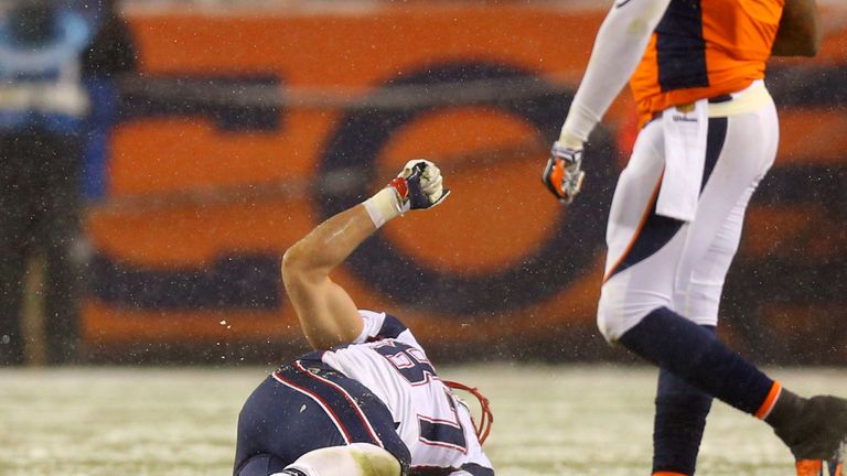 DENVER, CO - NOVEMBER 29: Tight end Rob Gronkowski #87 of the New England Patriots lies on the field injured against the Denver Broncos in the fourth quart
