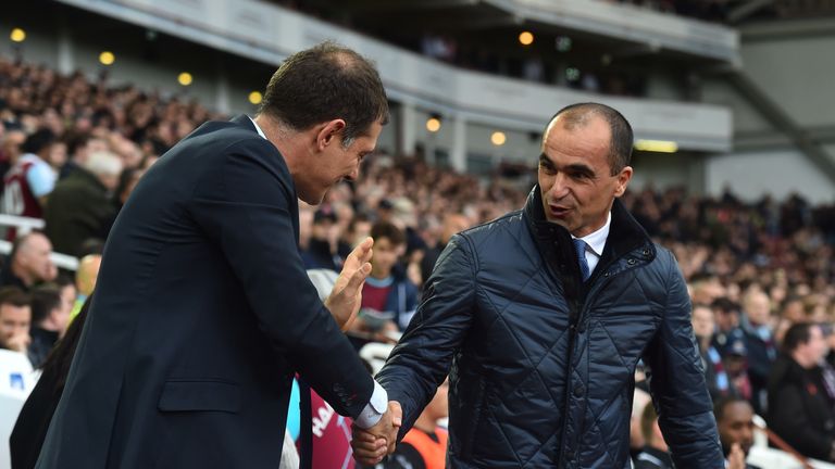 Everton manager Roberto Martinez (R) shakes hands with West Ham United manager Slaven Bilic (L)