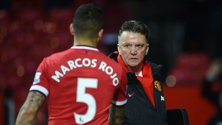 Manchester United manager Louis van Gaal with Marcos Rojo.