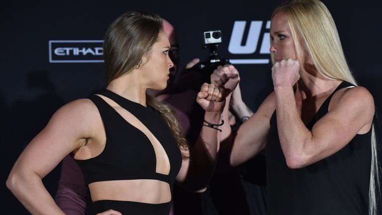 Ronda Rousey (L) faces-off with opponent Holly Holm (R) ahead of their UFC fight in Melbourne