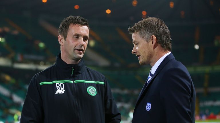 Ronny Deila, the manager of Celtic, chats with Ole Gunnar Solskjaer the head coach of Molde prior to kick-off during the Europa League match at Parkhead