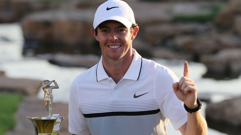 Rory McIlroy of Northern Ireland poses with the Race to Dubai trophy after he won the final round of the DP World Tour Championship 