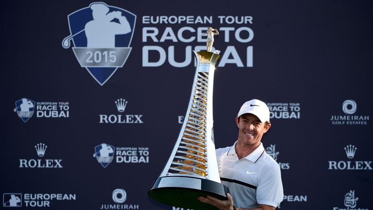 Rory McIlroy with the trophy after winning the DP World Tour Championship and Race to Dubai