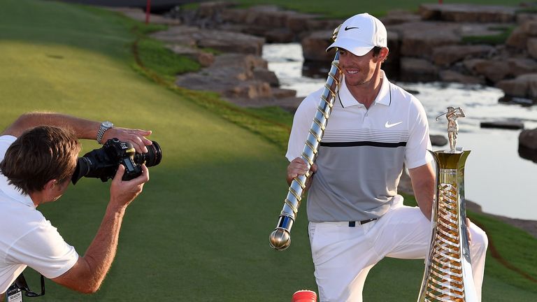 Rory McIlroy of Northern Ireland celebrates with the Race to Dubai Trophy after the final round of the DP World Tour Championship