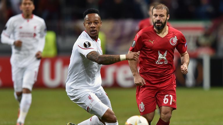 Liverpool's English defender Nathaniel Clyne (L) vies for the ball with Rubin Kazan's Turkish midfielder Gokdeniz Karadeniz