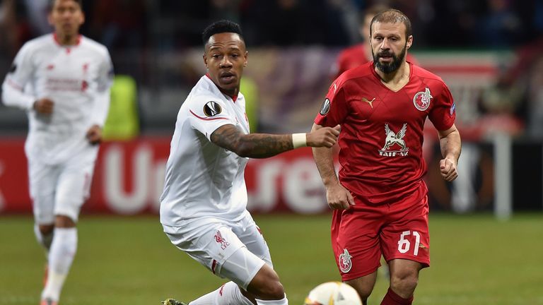 Liverpool's defender Nathaniel Clyne (l) vies for the ball with Rubin Kazan's Turkish midfielder Gokdeniz Karadeniz.
