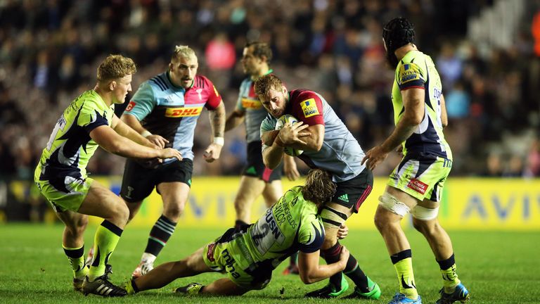 Harlequins flanker Chris Robshaw is tackled by Tommy Taylor of Sale