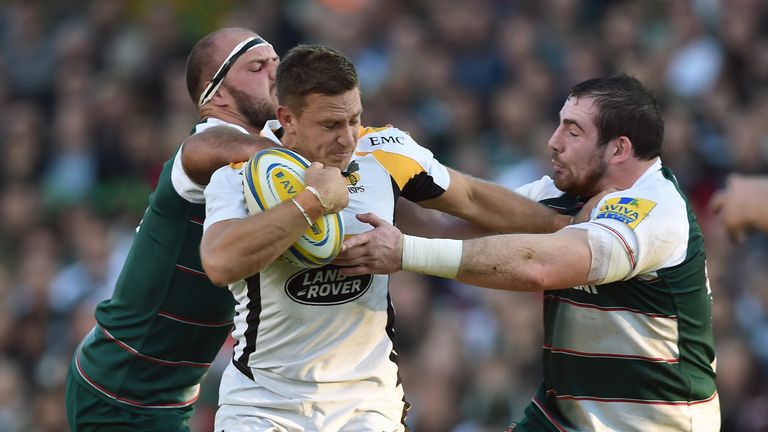 Wasps fly-half Jimmy Gopperth is tackled by Leicester Tigers' Lachlan McCaffrey (left) and Fraser Balmain