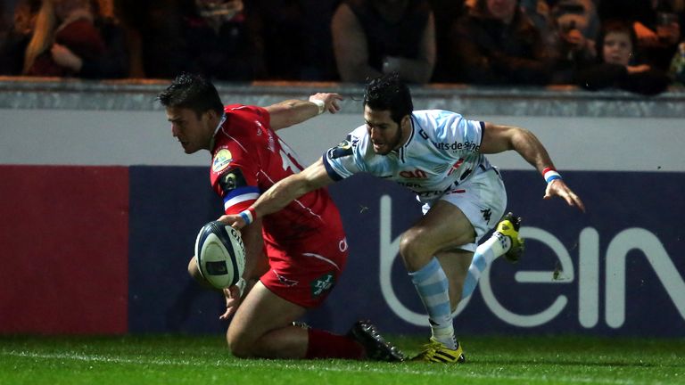 Maxime Machenaud of Racing 92 beats Scarlets wing DTH Van Der Merwe to the ball to score