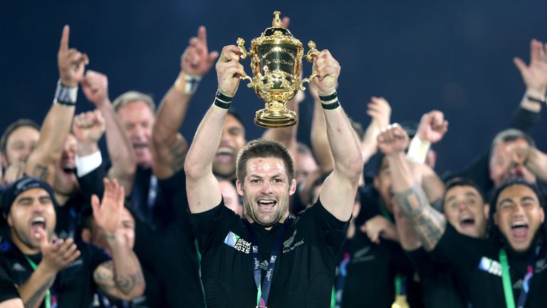 New Zealand captain Richie McCaw lifts the Webb Ellis Cup