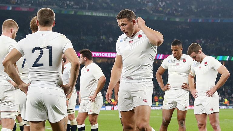 England's Sam Burgess looks dejected alongside teammates after their World Cup defeat to Australia