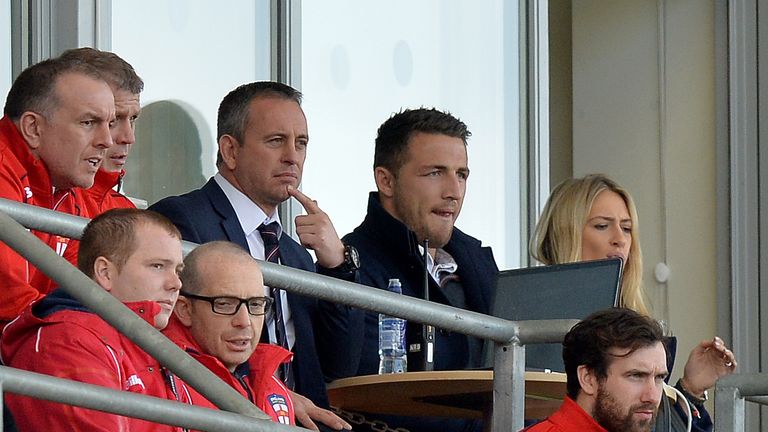 Sam Burgess (right) sits next to England coach Steve McNamara during their win over France on October 24