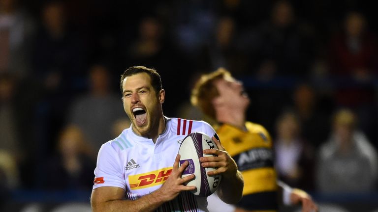 Harlequins wing Tim Visser celebrates as he races through to score against Cardiff Blues