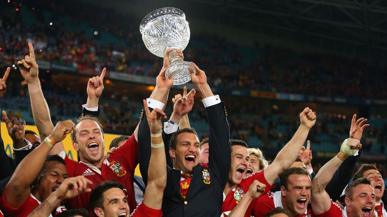 Injured captain Sam Warburton and Lions captain Alun Wyn Jones hold the Tom Richards Cup aloft after the Lions victory in the Australia