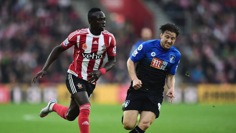 Sadio Mane of Southampton is chased by Harry Arter of Bournemouth