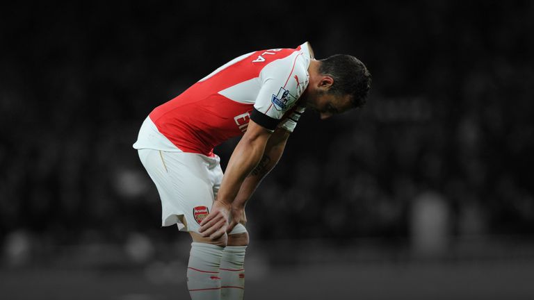 Arsenal's Santi Cazorla looks dejected