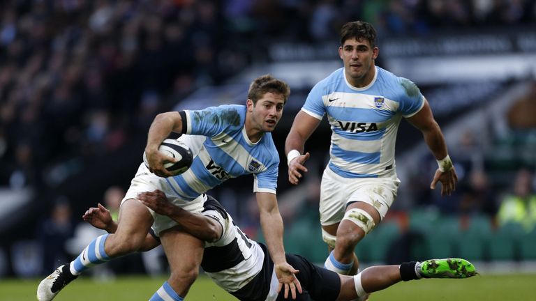 Argentina's Winger Santiago Cordero avoids a tackle by Barbarians' New Zealand Fly Half Lima Sopoaga to score his first try