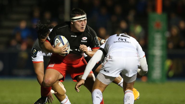 BARNET, ENGLAND - NOVEMBER 14:  Jamie George of Saracens takes on Toby Flood during the European Rugby Champions Cup match between Saracens and Toulouse at