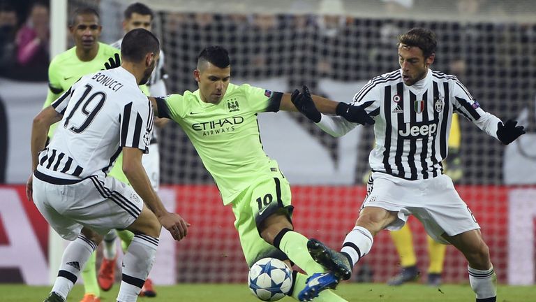 Manchester City striker Sergio Aguero (C) vies with Juventus defender Leonardo Bonucci (L) and Juventus midfielder Claudio Marchisio