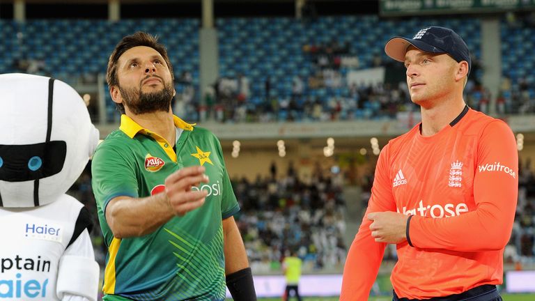 Pakistan captain Shahid Afridi tosses the coin alongside Jos Buttler
