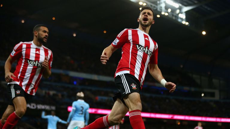 Shane Long (right) provides Southampton with hope, reducing a two-goal deficit to make it 2-1 against Manchester City
