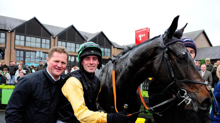 Shantou Flyer with Barry O'Neill and trainer Colin Bowe after winning the Florida Pearl Novice Chase at Punchestown.