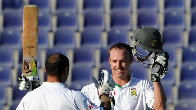 South African batsman AB de Villiers (R) celebrates with teammate Ashwell Prince after scoring a century on the first day of the second Test match between 