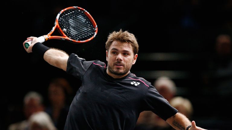 Stan Wawrinka of Switzerland in action against Bernard Tomic of Australia during Day 2 of the BNP Paribas Masters