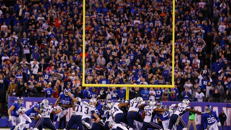 Stephen Gostkowski (3) kicks a late field goal to give the New England Patriots victory at the New York Giants.