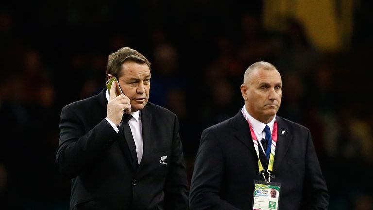 New Zealand All Blacks head coach Steve Hansen talks on his phone before he 2015 Rugby World Cup