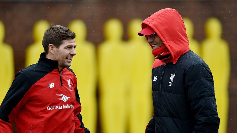 Steven Gerrard talks to Liverpool manager Jurgen Klopp during a training session at Melwood on Monday