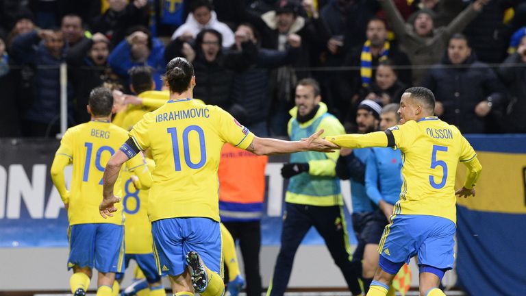 Sweden's forward and team captain Zlatan Ibrahimovic (L) and defender Martin Olsson celebrate