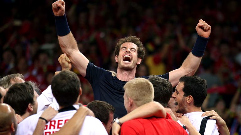 Great Britain's Andy Murray is mobbed by his team-mates after beating David Goffin to win the Davis Cup Final at the Flanders Expo Centre, Ghent.