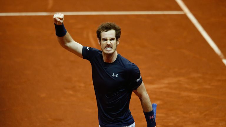 Andy Murray celebrates winning the second set during the singles match against David Goffin