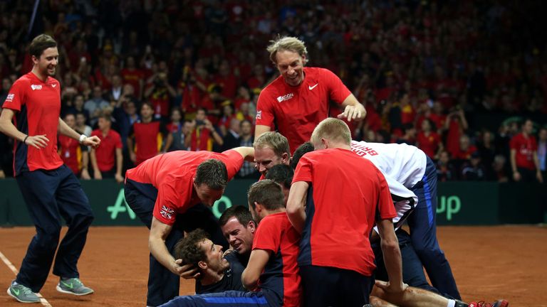 Great Britain's Andy Murray is mobbed by his team-mates after beating David Goffin to win the Davis Cup Final at the Flanders Expo Centre, Ghent. 