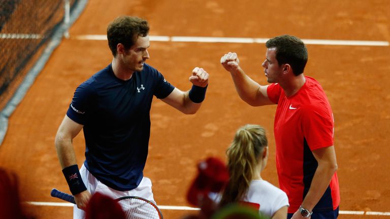 Andy Murray celebrates with Leon Smith against David Goffin of Belgium on day three of the Davis Cup Final