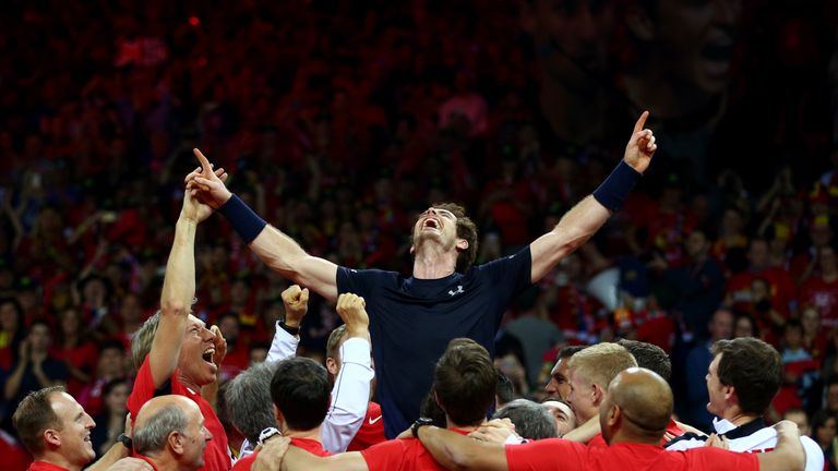 Andy Murray of Great Britain celebrates with his team after winning his singles match against David Goffin