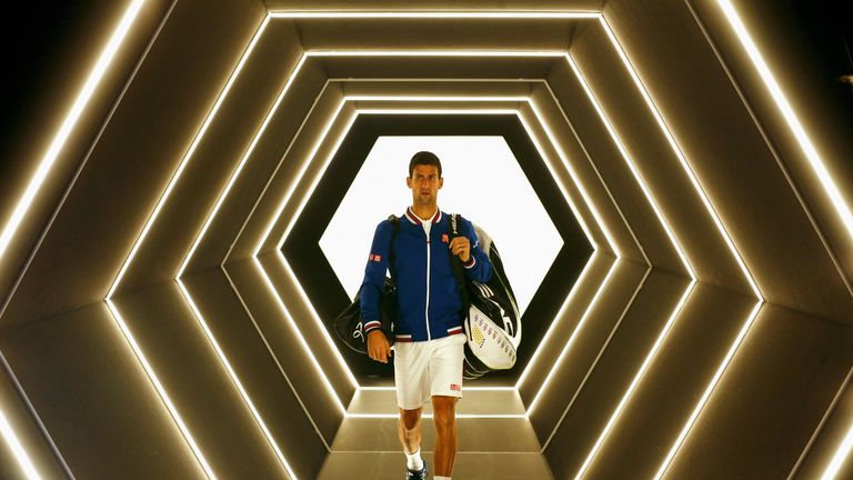 Novak Djokovic walks out to play his match against Tomas Berdych in Paris