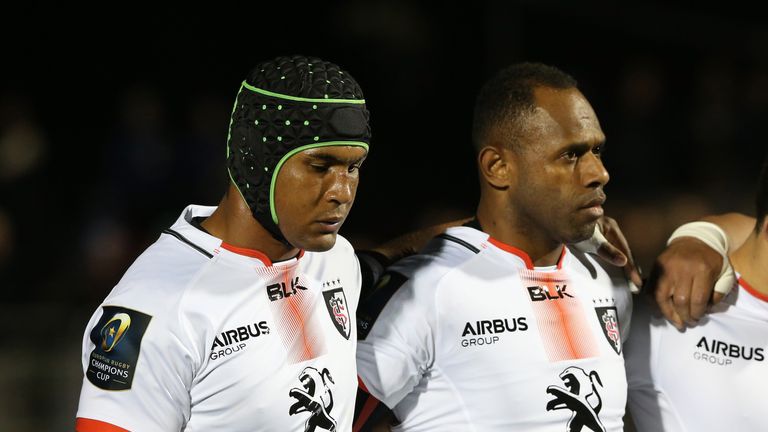  An emotional Toulouse and France captain Thierry Dusautoir (L) lines up with his team for a minutes silence