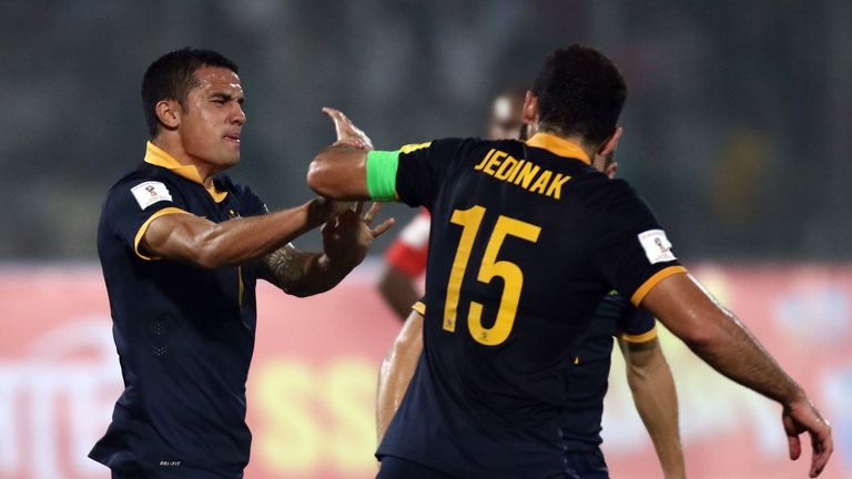 Tim Cahill of Australia celebrates with Mile Jedinak after scoring his first goal.