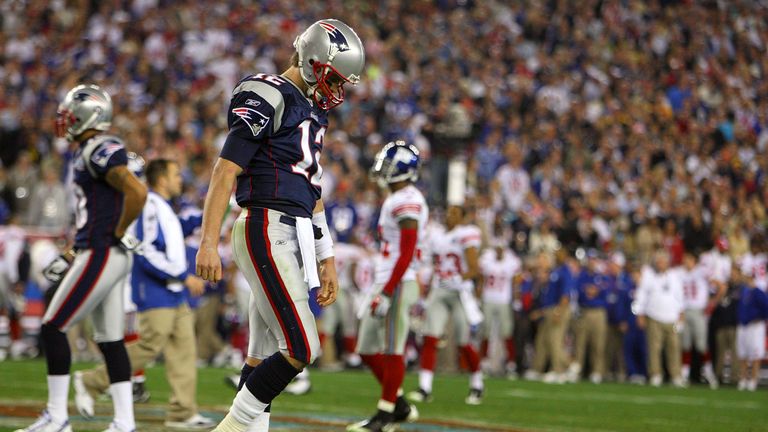 Quarterback Tom Brady walks off after losing the 2008 Super Bowl to the New York Giants