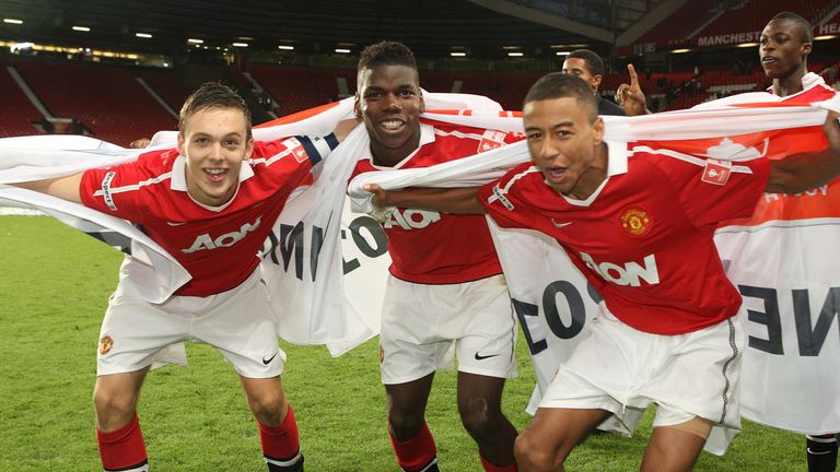 Thorpe (right) celebrates with Paul Pogba and Jesse Lingard in 2011