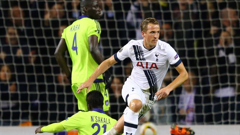 Harry Kane of Spurs turns away to celebrate after scoring the opening goal 