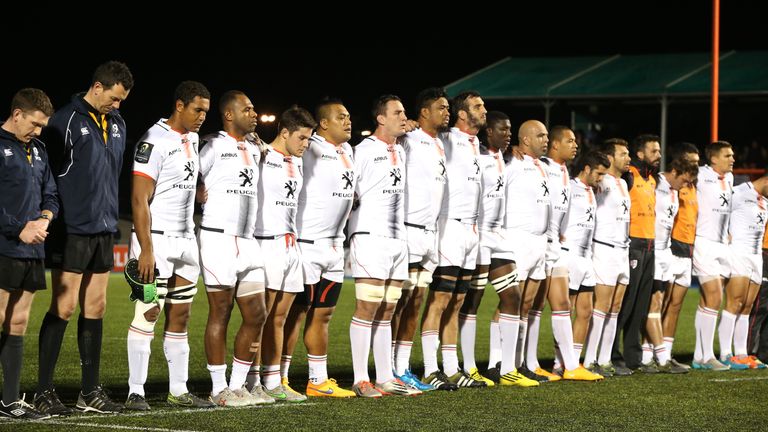 The Toulouse team line up for a minute's silence ahead of their Champions Cup match with Saracens