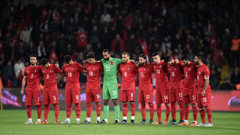 Turkey's players observe a a minute of silence to pay tribute to victims of attacks 