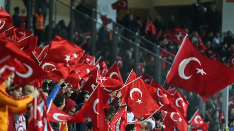 Turkish supporters wave flags during an international friendly soccer match between Greece and Turkey November 17, 2015  